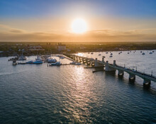 Aerial View At Sunset Of The Bridge Of Lions Looking Towards Historic Downtown St Augustine, Florida, United States.