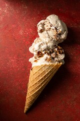 Poster - Top view of a  chocolate ice cream against a bright red backdrop