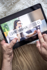 Wall Mural - top view of digital tablet with search job on screen in male hands.