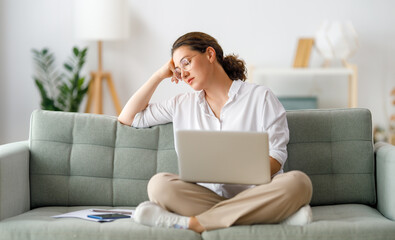 Sticker - Tired woman working on laptop