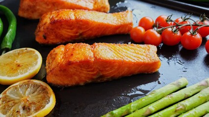 Poster - grilled cooking fillet salmon with asparagus, tomato, lemon, on grill, close up, outdoor