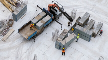 Wall Mural - Group of workers moving concrete block with truck crane at the construction site