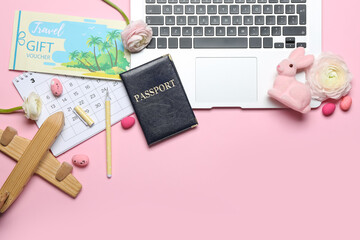 Sticker - Laptop with travel accessories, flowers, Easter eggs and rabbit on pink background