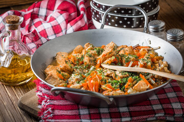 Canvas Print - Fried chicken pieces with vegetables.