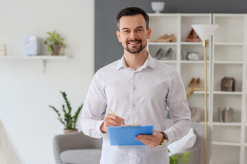 Poster - Male wedding planner with clipboard working in office