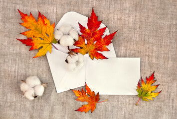Wall Mural - autumnal maple leaves, cotton flowers in postal envelope and blank white sheet with space for text o