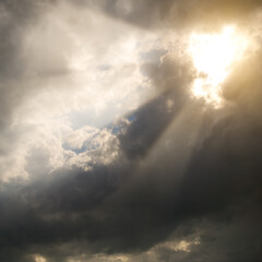 Sticker - Sunbeams through storm clouds.