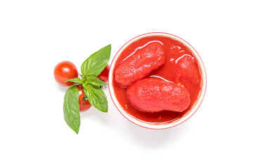 Bowl of canned tomatoes and basil on white background