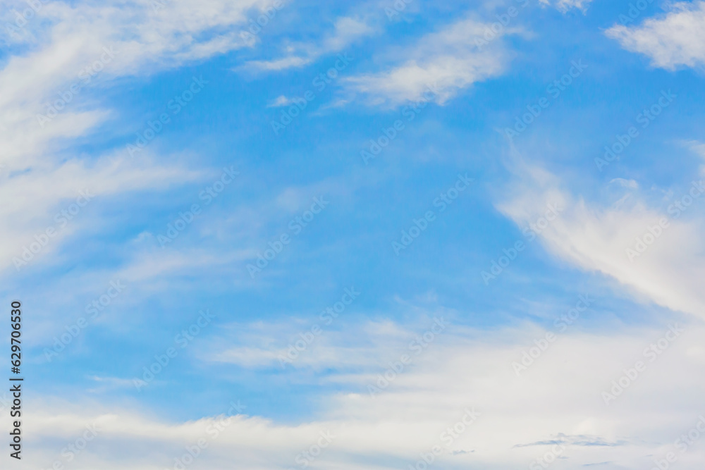 Beautiful cirrus clouds at sunrise in summer sunny day. Nature atmosphere background or wallpaper