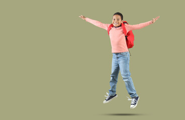 Sticker - Jumping African-American boy with school backpack on green background