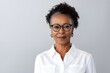 © Adriana - Attractive mature black businesswoman wearing glasses posing looking at the camera on white background