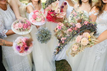 Wall Mural - Many brides hold their wedding bouquet in their hands