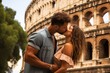 A couple kissing in front of the Colosseum. Rome, Italy
