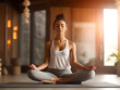 © AspctStyle - Young sporty woman practicing lotus asana in yoga studio. Woman do meditation practice with eyes closed alone indoor. Well being, wellness concept