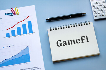 Poster - There is notebook with the word GameFi. It is as an eye-catching image.