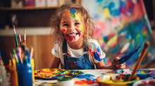 Girl's Face Beaming With Excitement As She Engages With A Set Of Art Supplies. The Close-up Shot Captures The Child's Intense Concentration And The Vibrant Colors Of The Paints And Brushes. 
