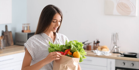 Sticker - Young woman with fresh products from market at home