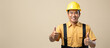 asian male construction worker with safety helmet and thumb up on beige background