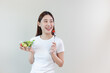 © eakgrungenerd - Happy woman eating salad vegetables. Female and healthy food diet. Want to lose weight. Eat healthy diet. Choose vegetable salad menu. Food full of benefits. Copy space.