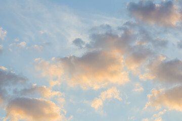 Wall Mural - blue sky background with golden clouds at sunset