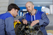© auremar - two aircraft mechanics working on engine