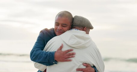 Canvas Print - Senior father, man and hug at beach with love, care and bonding on vacation, holiday or travel outdoor at sunset. Elderly dad, adult son and embrace at ocean, sea and happy for family time together