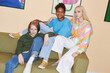 Fashion portrait of teenagers wearing colorful casual clothes indoors, shot with flash