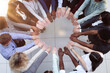 © Katsiaryna - Friends with stack of hands showing unity and teamwork.