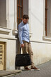 © Mykola - Handsome businessman walking on the street, with luxury leather briefcase. Fashionable style.