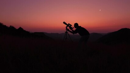 Wall Mural - astronomer looking at the starry skies and crescent moon with a telescope.