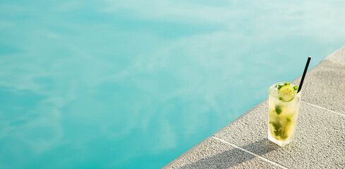 Canvas Print - Resort swimming pool, a glass of cool limeade