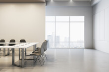 Clean Concrete Meeting Room Interior With Empty Mock Up Place On Wall, Furniture And Window With City View. 3D Rendering.