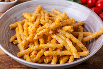 Wall Mural - Sicilian pasta with almond and tomatoes pesto. Typical Italian food from Sicily, pasta with red pesto.