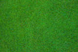 overhead of the green grass of a soccer field or golf course for background or texture.Green grass in the stadium