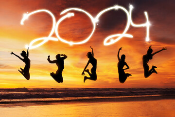 Group silhouette of young women jumping together celebrating for the new year 2024