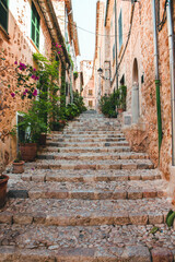  View of a medieval street in the Old Town of the picturesque Spanish-style village Fornalutx, Majorca or Mallorca island