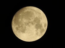 Yellow Moon On A Black Background, Super Full Moon. Black Sky. Nature