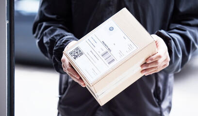 Sticker - Box, hands and courier at with mail for a delivery, ecommerce work or cargo shipping. Closeup, logistics and man or person with package, stock or front door freight wholesale or distribution service