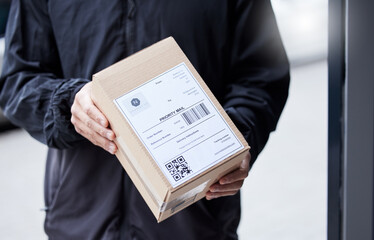 Poster - Box, hands and courier at entrance for a delivery, ecommerce work or cargo shipping. Closeup, logistics and man or person with a package, stock or front door freight wholesale or distribution service