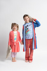 Wall Mural - Children - brother and sister in pajamas with pillows in their hands. Boy and girl.