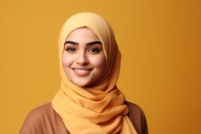 Smiling Happy Arab Asian Muslim Woman In Yellow Hijab Clothes Isolated On Yellow Background Studio Portrait. Uae People Middle East Islam Religious Concept. Generative AI