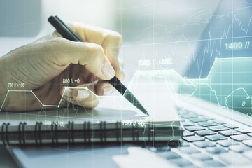 Poster - Multi exposure of abstract graphic data spreadsheet sketch with hand writing in diary on background with laptop, analytics and analysis concept