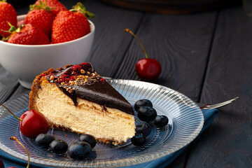 Wall Mural - Vanilla cheesecake with chocolate top and berries