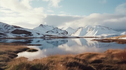 Canvas Print - The snow-capped mountains in the distance are reflected in the nearby water, generated by AI