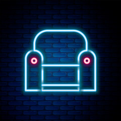 Poster - Glowing neon line Armchair icon isolated on brick wall background. Colorful outline concept. Vector