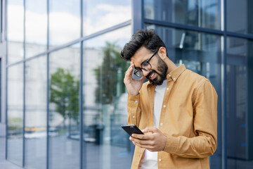 Upset businessman received message with bad news, hispanic man outside office alarm clock cheated and bankrupt, man unhappy with achievement results walking in city.