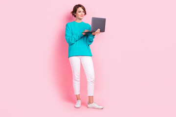 Wall Mural - Full length photo of lovely young lady hold netbook marketer smm manager wear trendy blue garment isolated on pink color background