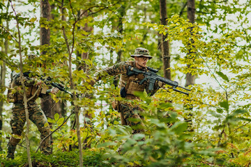 Wall Mural - A modern warfare soldier on war duty in dense and dangerous forest areas. Dangerous military rescue operations