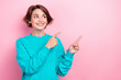 © deagreez - Photo of pretty curious woman indicating fingers empty space interesting poster wear oversize pullover isolated pink color background
