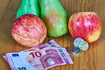 Canvas Print - Fruit lying together with European money.